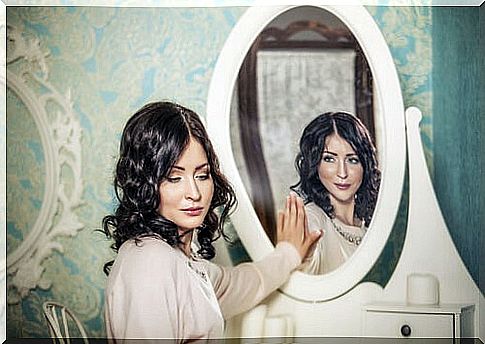 Woman in the mirror showing the two faces of conformity