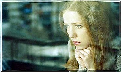 girl looking out window and thinking about cognitive dissonance