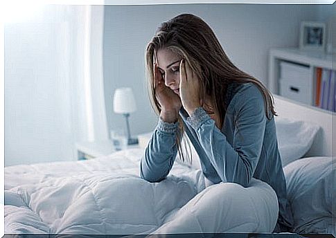 Woman With Sleep Problems In Bed Suffering From Frontal Lobe Epilepsy