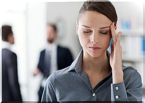 Stressed woman at work representing how to get back to work after a depression