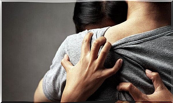 Woman hugging partner who hurts her