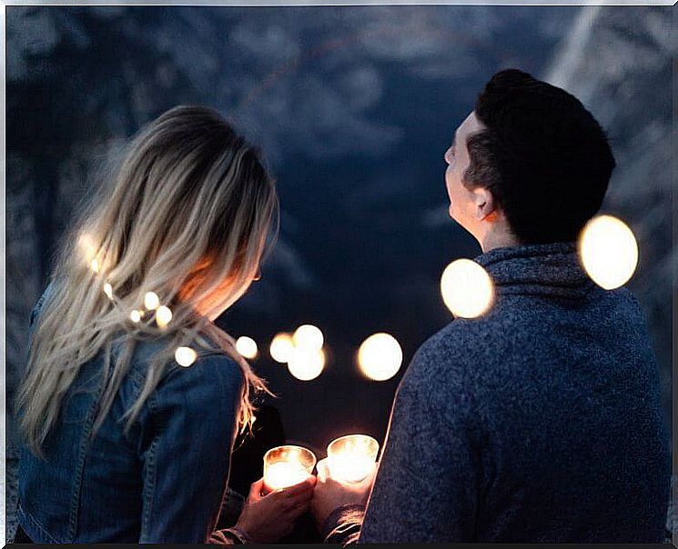 Couple with lights at night