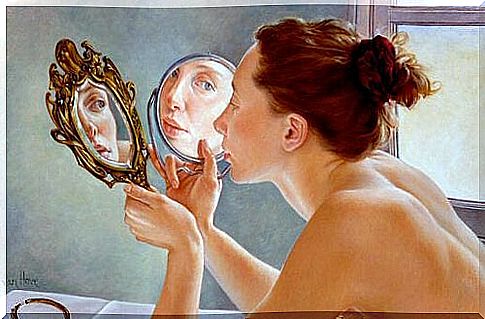 Woman in front of a mirror showing self-recognition