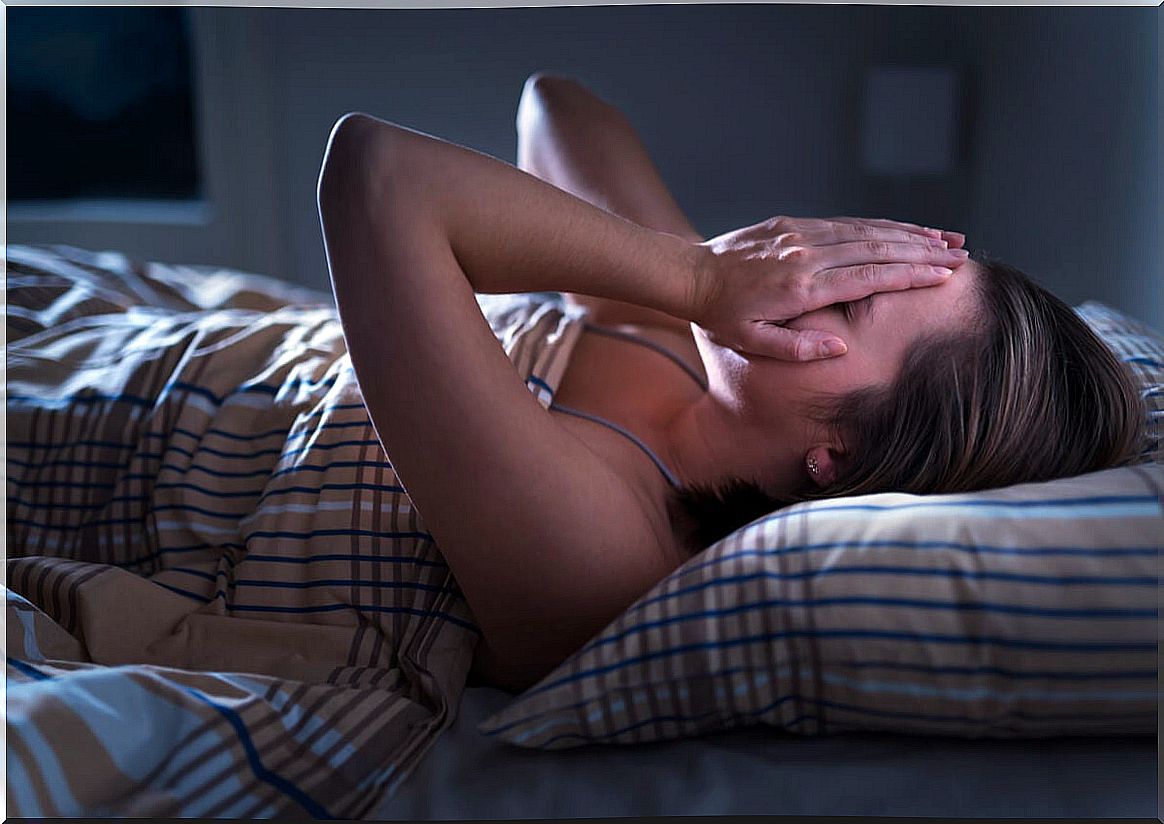 Woman with insomnia from chronic pain