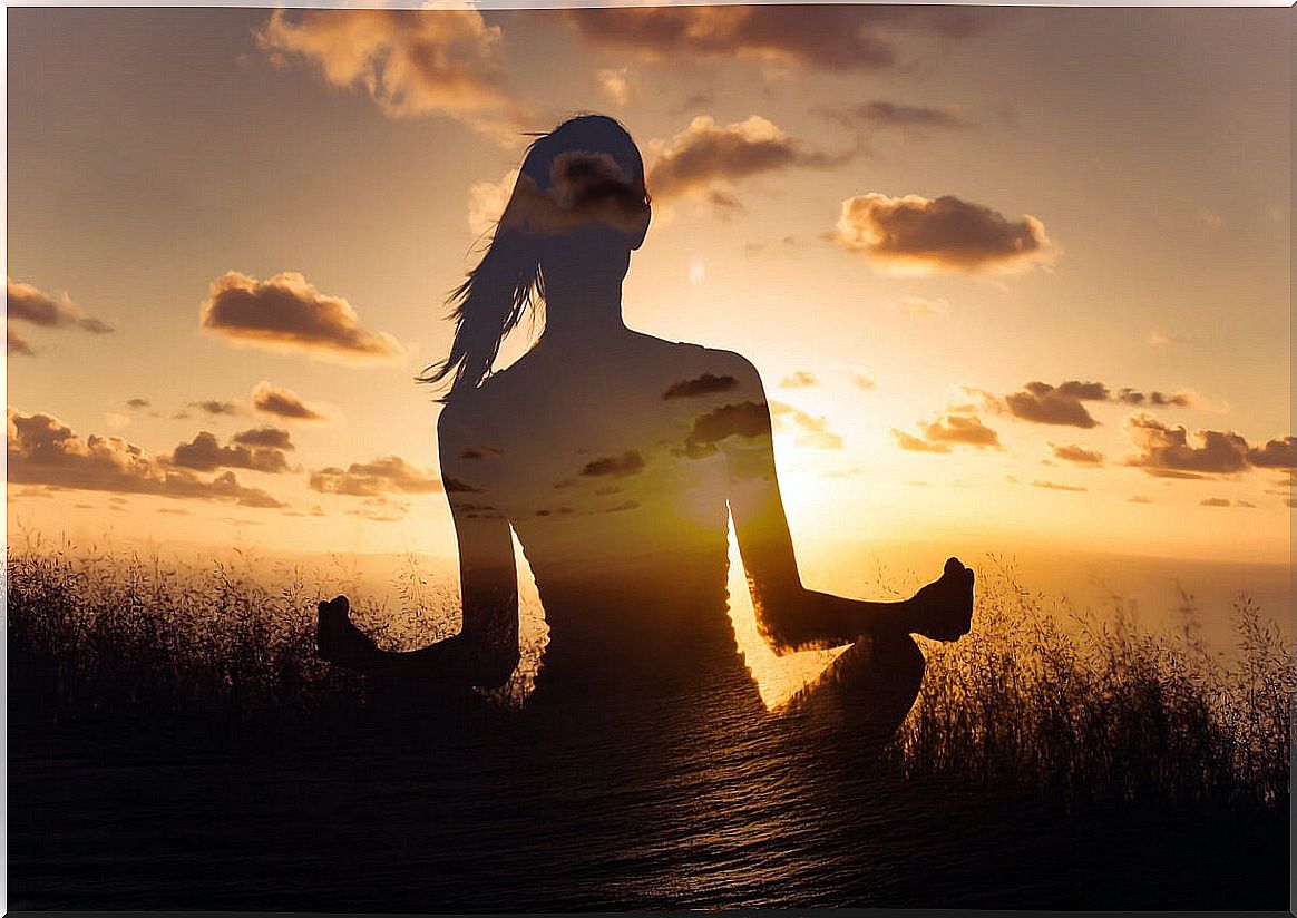 Woman meditating in the field